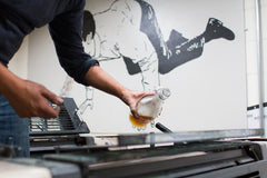 A small amount of cider is added to the ink used on the tasting book's cover.